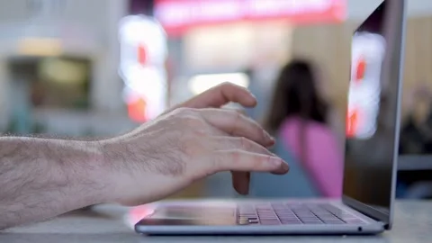 Person's hands actively use laptop keyboard indoors 스톡 동영상 341073741