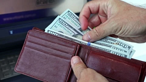 Person's hands count 100 dollar banknotes in brown leather wallet Video stock 329671421