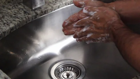A person's hands doing the proper hand washing process Stock Footage 126617149