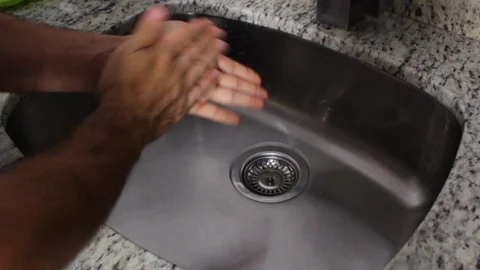 A person's hands doing the proper hand washing process Video stock 126617386