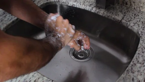 A person's hands doing the proper hand washing process Video stock 126617490