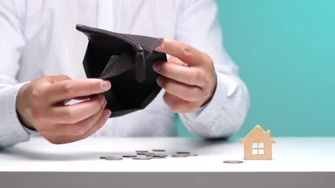 Person's hands holding an empty leather wallet with very few coins and a small Stock Footage 342766110