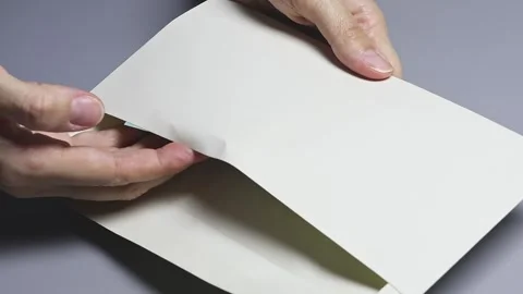 A person's hands put Vietnamese dong (VND) banknotes in the envelope Stock Footage 336718305