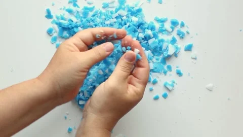 A person's hands scatter, sort out blue, white slices. Asmr. Stock Footage 246599615