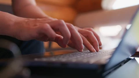 Person's hands typing quickly on a laptop Stock Footage 334125278
