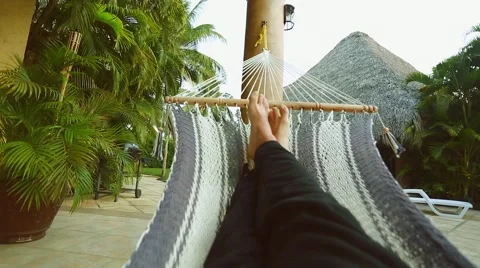 Person's legs resting on a Hammock Stock Footage 49141696