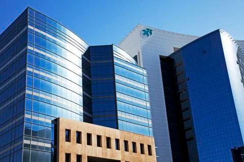 Perspective and underside angle view of modern glass building skyscrapers ove Stock Photos