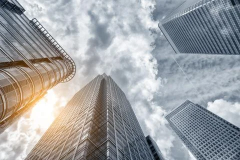 Perspective and underside angle view modern glass building skyscrapers over c Foto stock