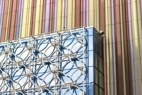 Perspective angled shoot of glazed facade before colorful wall Stock Photos