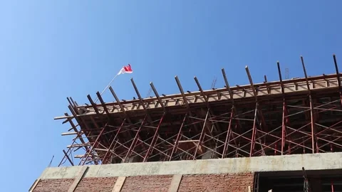 Perspective of a building under construction with scaffolding Stock Footage 161108512