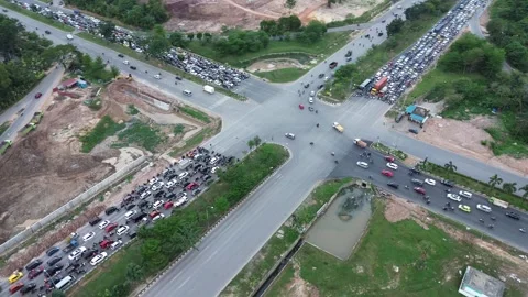 Perspective on a Busy City Intersection with Traffic Congestion during Rush Hour Stock Footage 320064201