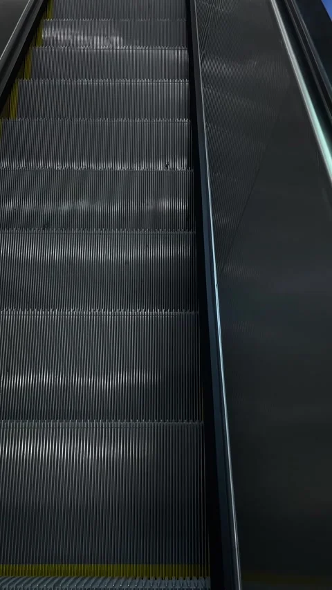 Perspective captures feet on escalator with safety lines and motion Stock Footage 335368204