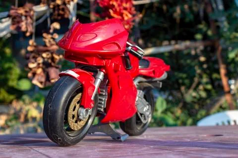 Perspective close bottom shoot of red small kid toy bike Stock Photos