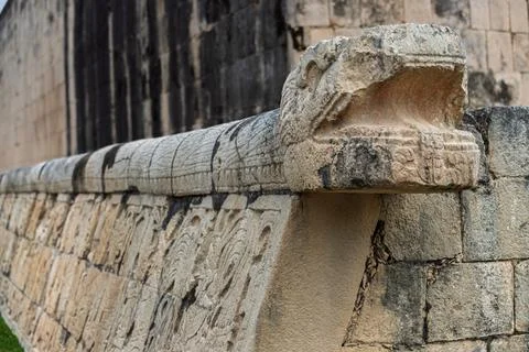 Perspective close up of the carved stone serpent head ring and body along the Gr Stock Photos