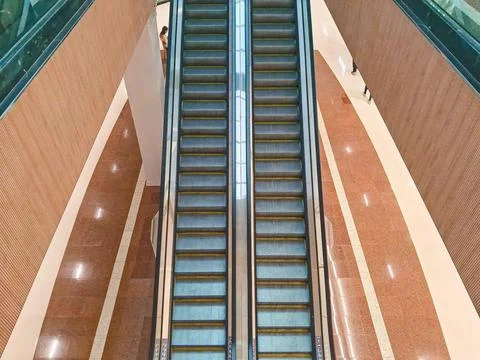 Perspective details of an escalator. Stock Photos