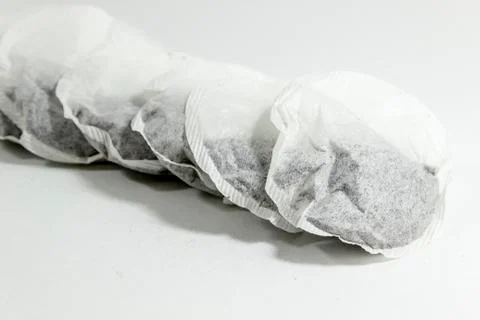 Perspective diagonal close shoot of couple tea bags on white background Stock-Fotos