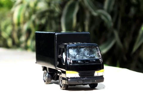 Perspective front view of a black lorry toy truck Stock Photos