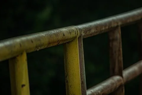 Perspective of industrial iron railing rust texture steel structure at ni Stock Photos