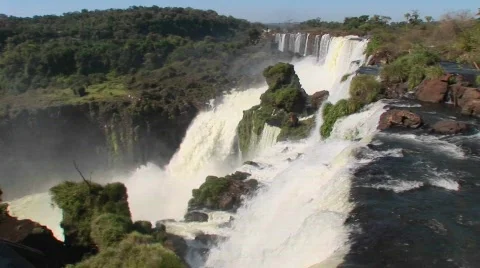 A perspective looking over the edge of a waterfall, Iguacu Falls. Stock Footage 553857