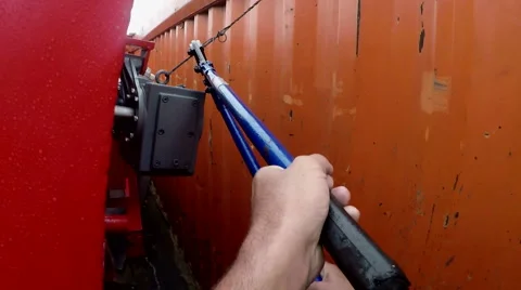 The perspective of a man who uses a huge shears to cut a metal cable. Stock Footage 67367239