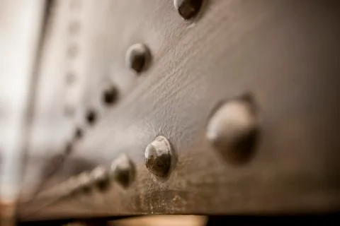 Perspective of Rusty Black Boxcar With Rivets Stock Photos