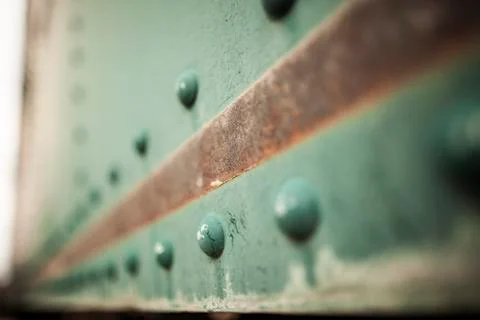 Perspective of Rusty Green Boxcar With Rivets Stock Photos