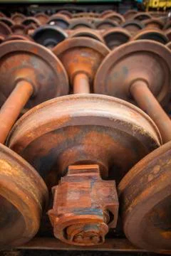 Perspective of Rusty Rail Wheels - Tain Yard - Junk Yard - Iron Stock Photos