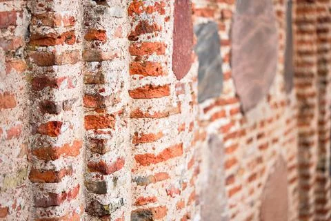 Perspective selective focus red brick wall texture background. Ancient masonry Stock Photos