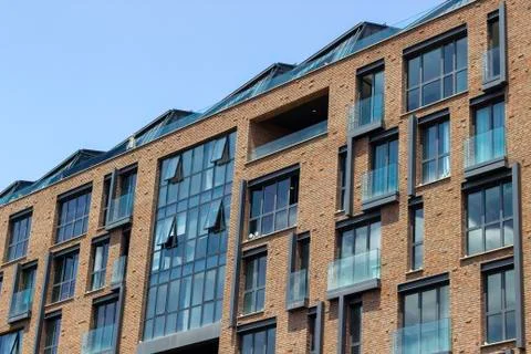 Perspective shoot of brick and open glazing facade office building Stock Photos