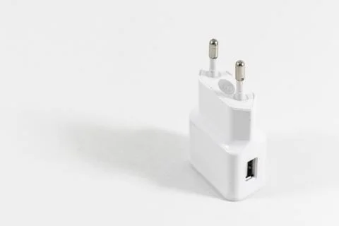 Perspective shoot of white colored mobile phone charge adapter Stock-Fotos