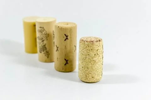 Perspective shot of multiple wine corks with blurry white background Stock Photos