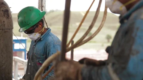 Perspective Shot of two oil and gas Workers Stock Footage 45236431