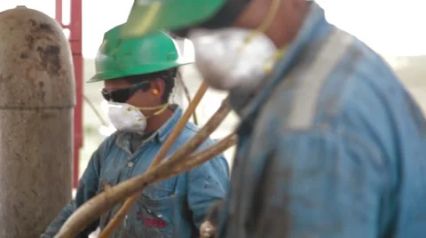 Perspective Shot of two oil and gas Workers Stock Footage 45236452