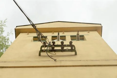 Perspective showing overhead power lines with sky background Stock Photos