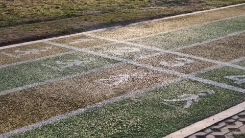 This perspective shows a jogging track being used for running or walking at Stock Footage 340391212