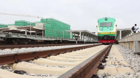 Perspective of train tracks with train in the distance Stock Footage 75893892