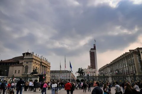Perspective view of Castello square crowded under cloudy sky in Turin Italy Foto stock