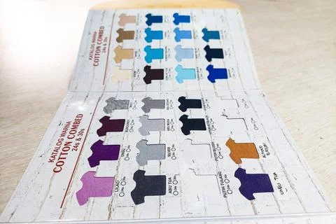 A perspective view of a colorful combed cotton fabric catalog displayed on .. Stock Photos