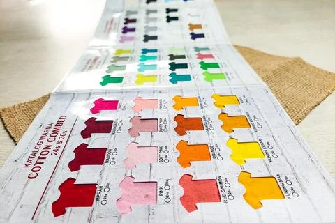 A perspective view of a colorful combed cotton fabric catalog displayed on .. Stock Photos