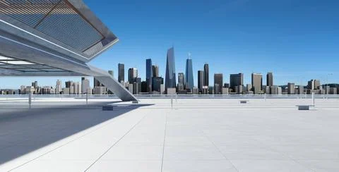 Perspective view of empty concrete floor and modern rooftop building Persp... Fotos de archivo