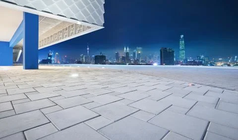 Perspective view of empty floor with modern building exterior and cityscape s Stock Photos