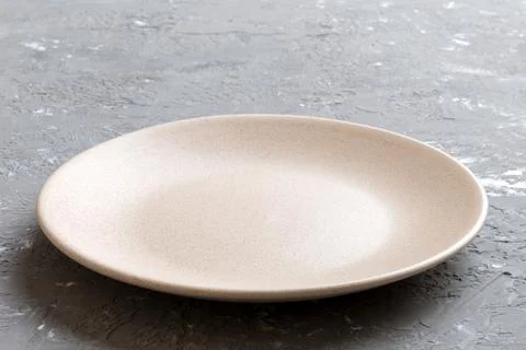 Perspective view of empty light plate on cement background. Empty space for.. Stock Photos