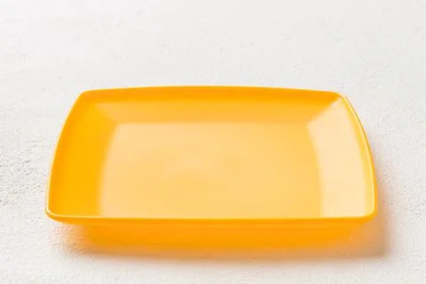 Perspective view of empty square plate on cement background. Empty space for  Foto stock