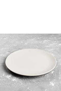 Perspective view. Empty white plate on gray background Stock Photos