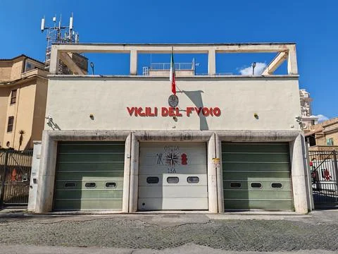 Perspective view of the facade of the historic building, with the red sign Fotos de archivo