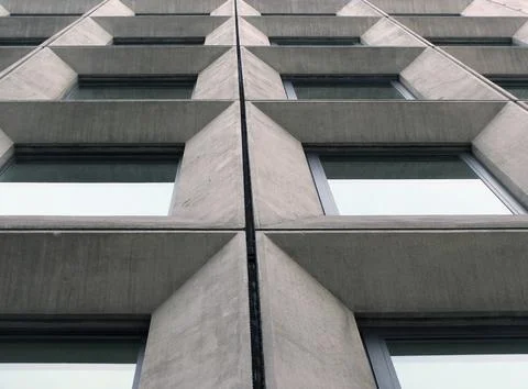 Perspective view of geometric angular concrete windows on the facade of a 스톡 사진