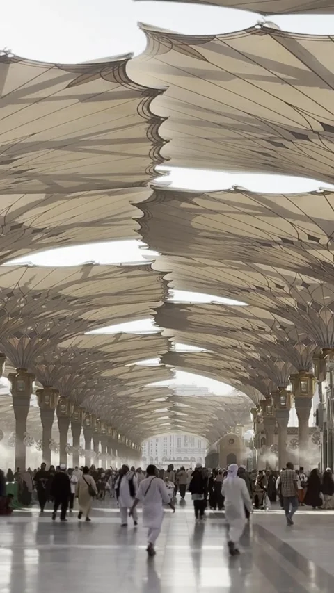 Perspective View of Giant Retractable Sunshade Umbrellas at the Prophet's Mosque Stock Footage 323159420