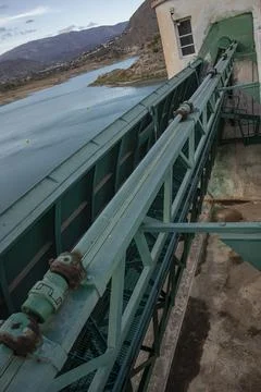Perspective view of green steel framework and mechanical spillway structure.. Stock Photos