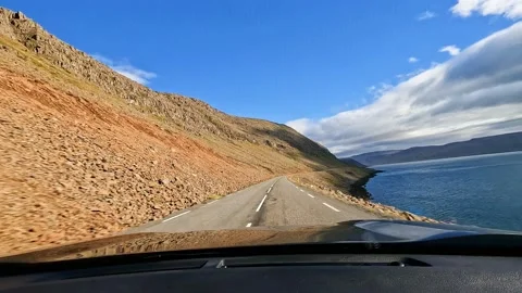 Perspective view of Iceland ring road with natural lanscape from driver's Stock Footage 227328891