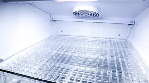 Perspective view inside an empty clean refrigerator looking from the left a.. Stock Photos